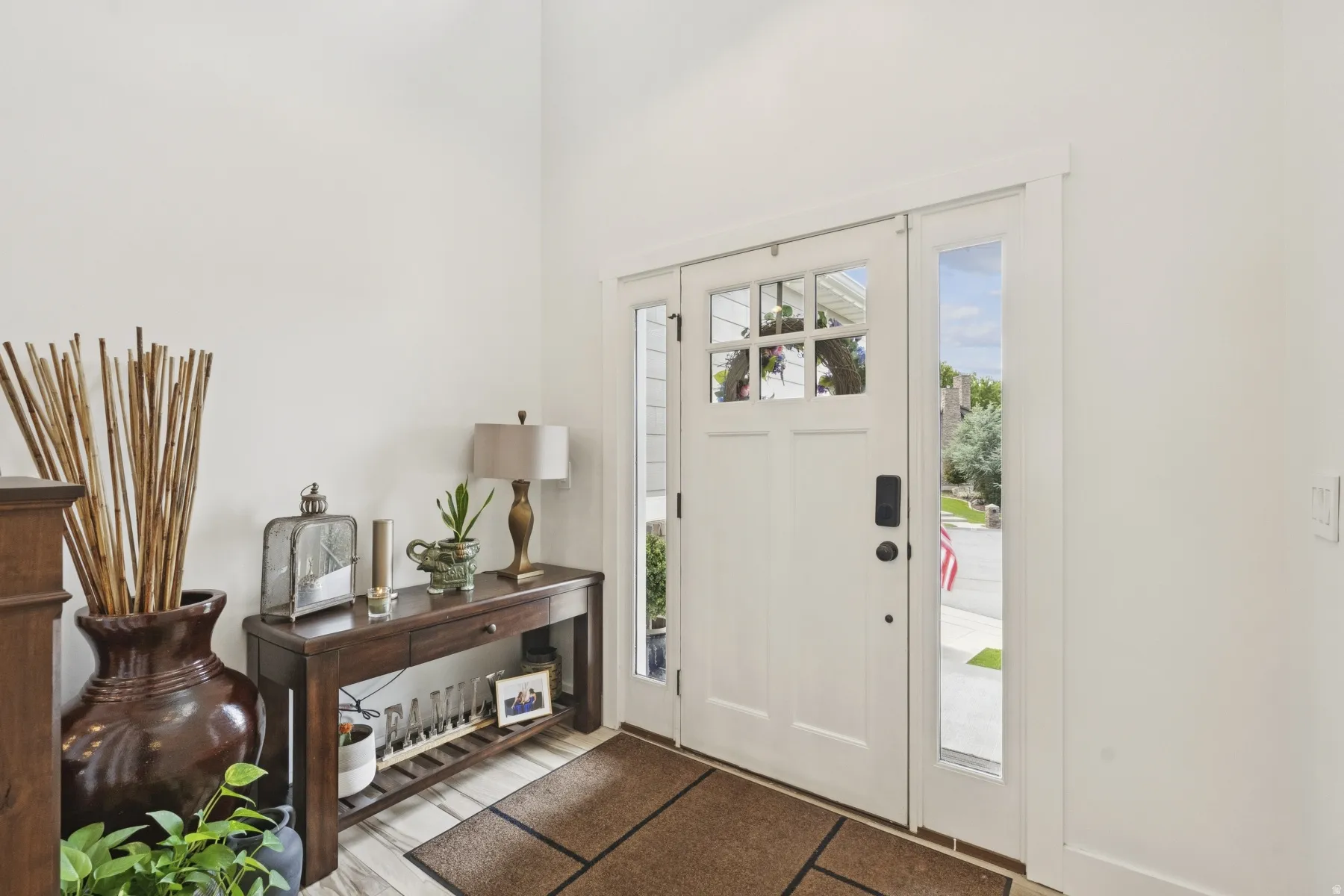 Entrance foyer featuring light wood-style floors