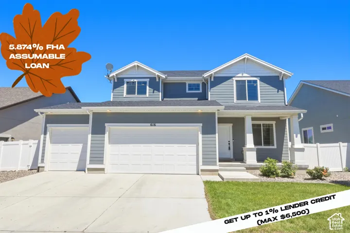 Two-story residence featuring a blue siding exterior, white trim accents, and a covered front porch with white columns