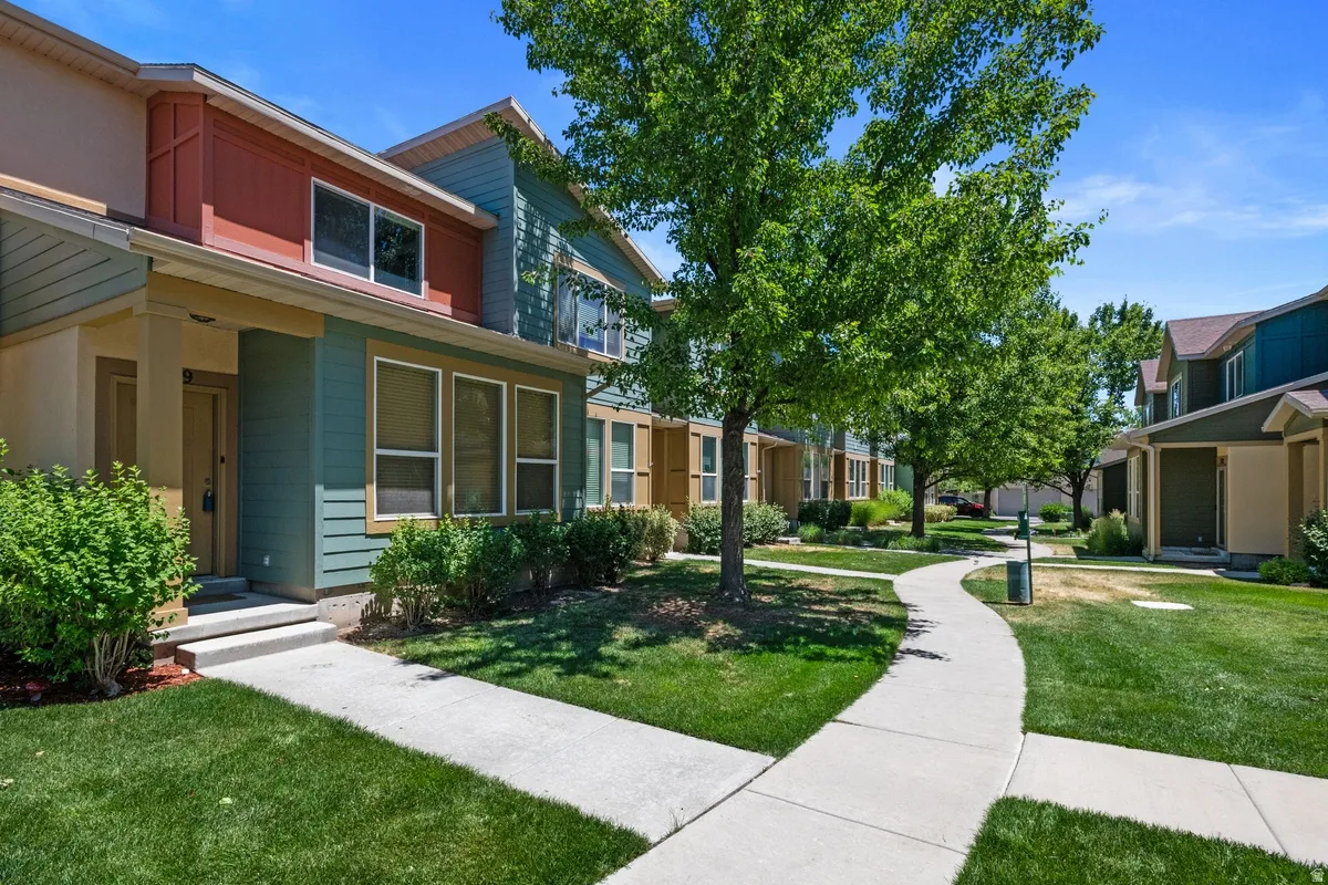 Multi-level facade with warm earth tone siding and white trim