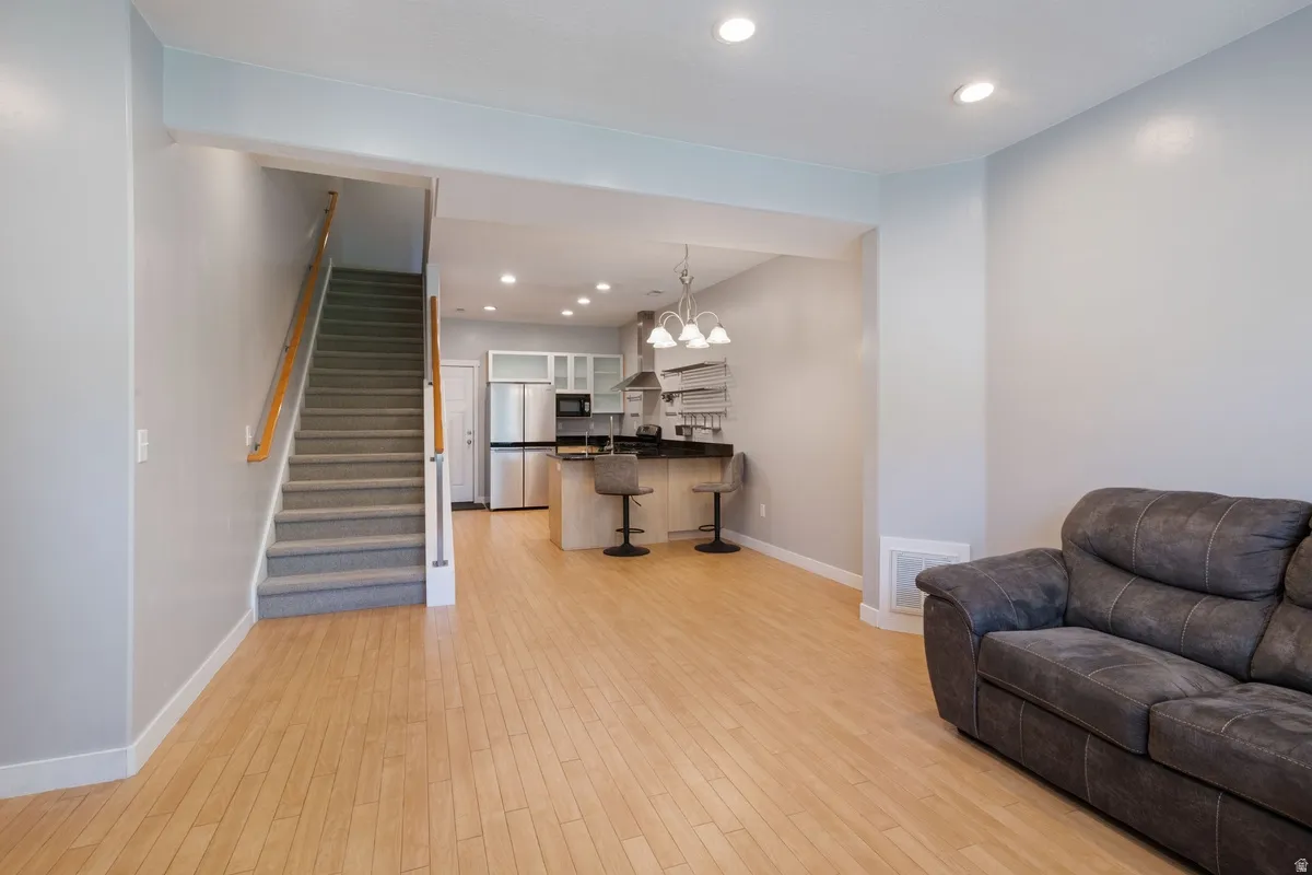 Open-concept living area with wood-finish flooring
