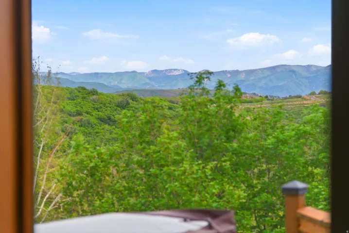 Expansive mountain scenery with rolling green hills