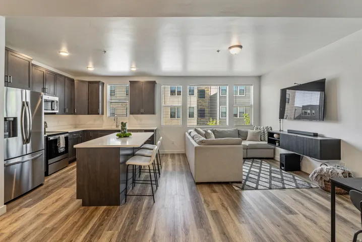 Open-concept living space featuring wood-finish flooring