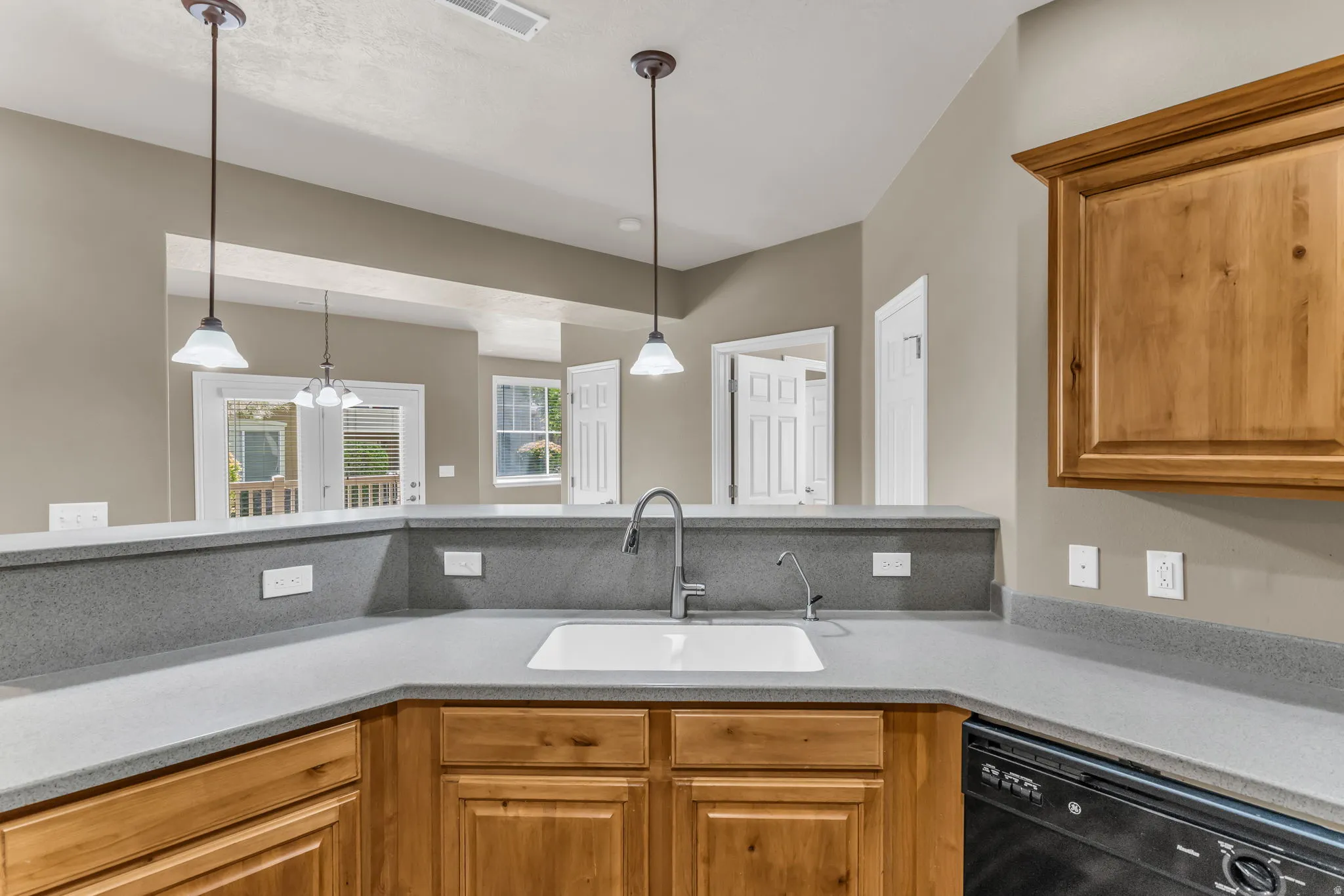 Open kitchen featuring a practical workspace and abundant natural light.