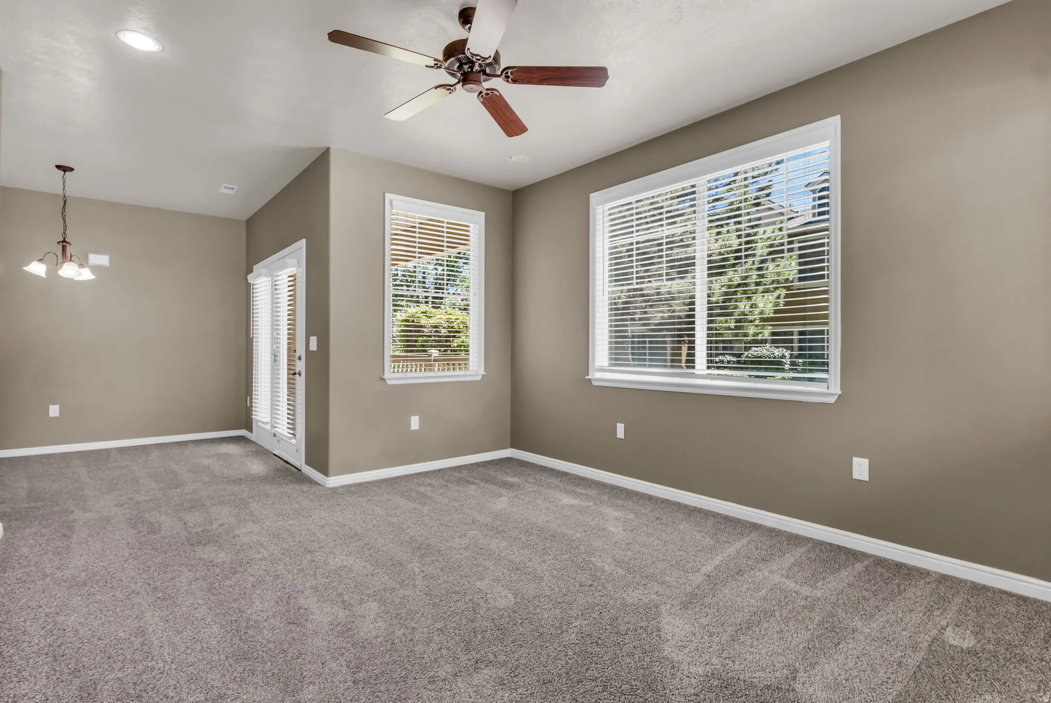Light-filled main living area with an open flow to kitchen and dining spaces.