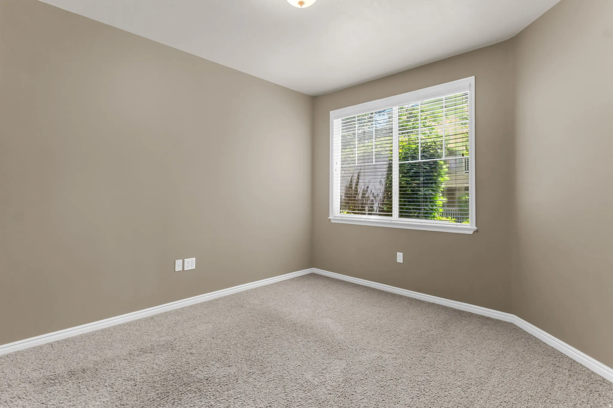 Well-sized 3rd bedroom with versatile use potential for guests or office.