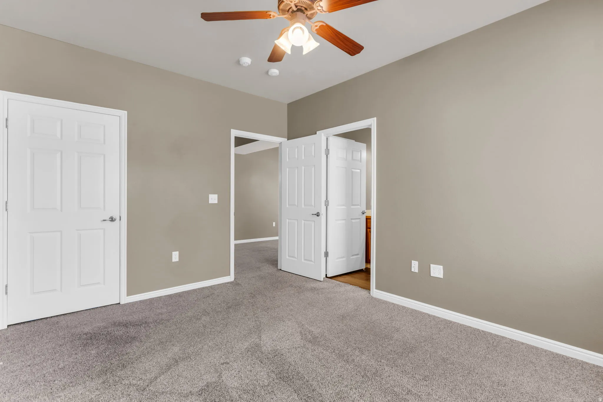 Spacious primary suite with abundant natural light and a walk-in closet.