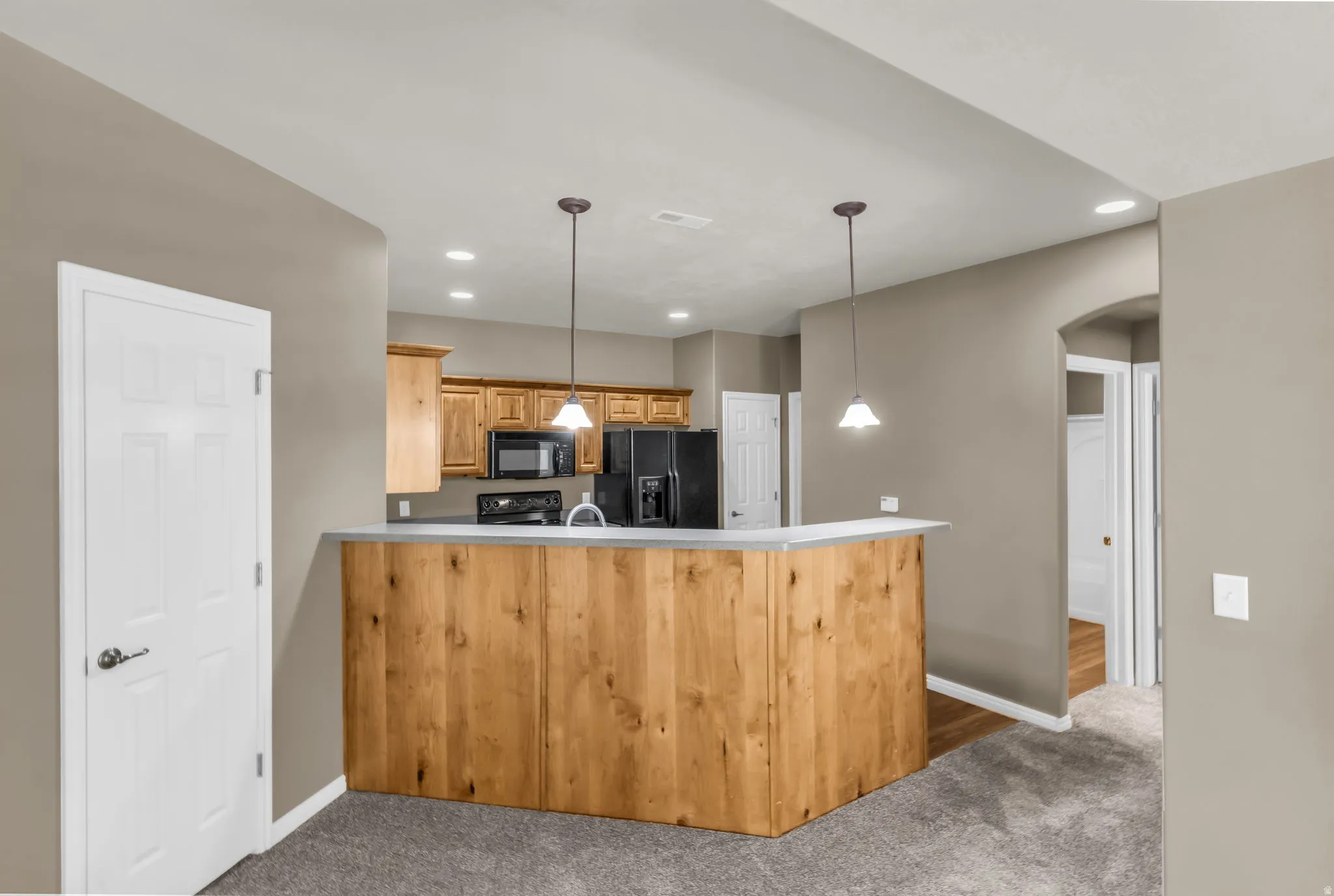 Well-appointed kitchen with seamless flow to dining and living areas.