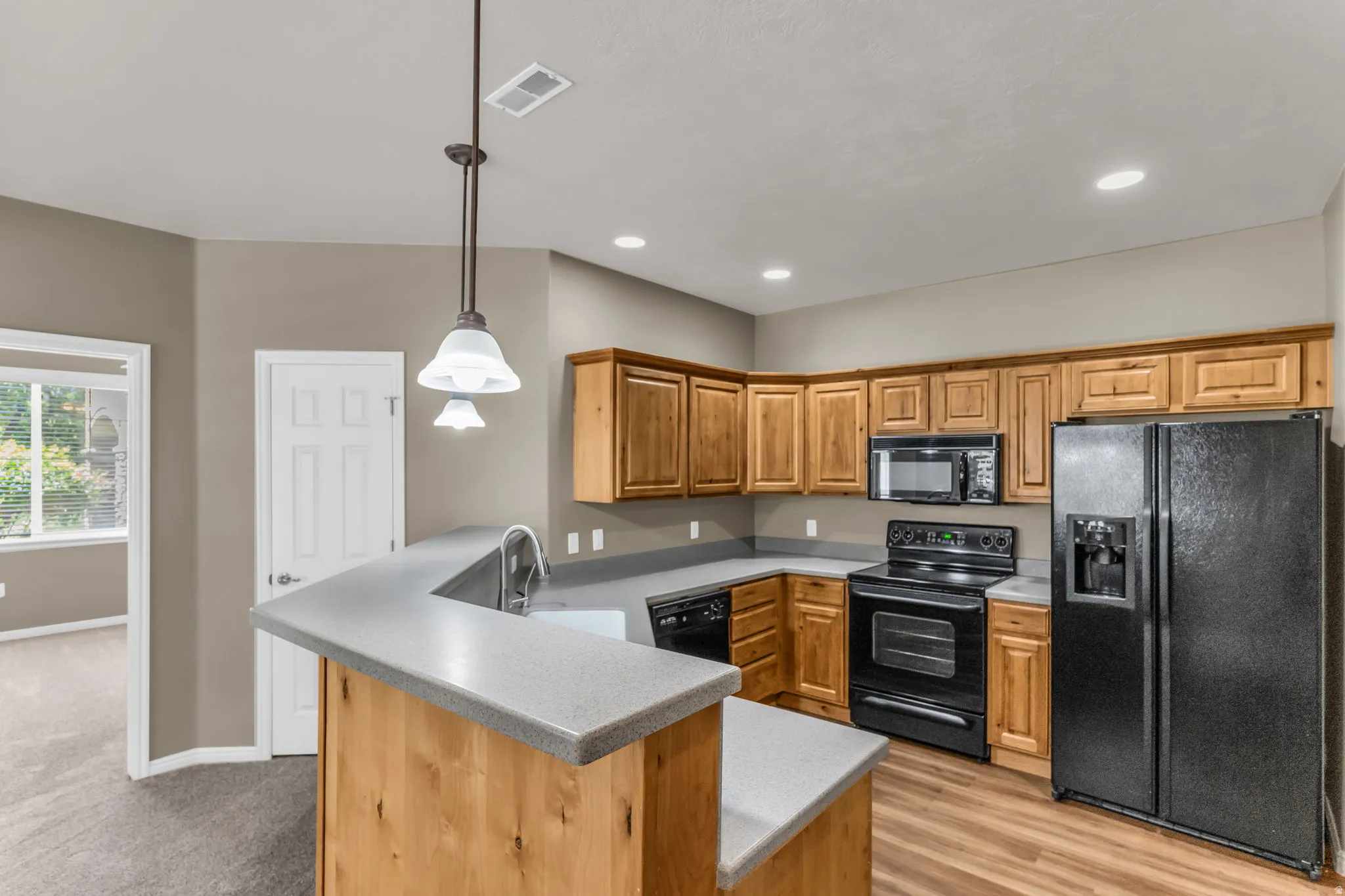 Functional kitchen with bar seating and efficient layout.