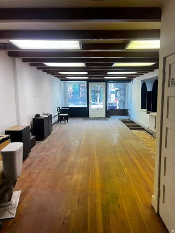 Exposed wood beam ceiling with recessed lighting