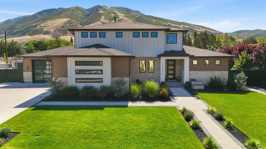 Contemporary exterior with a multi-textured facade including horizontal siding and stucco finishes