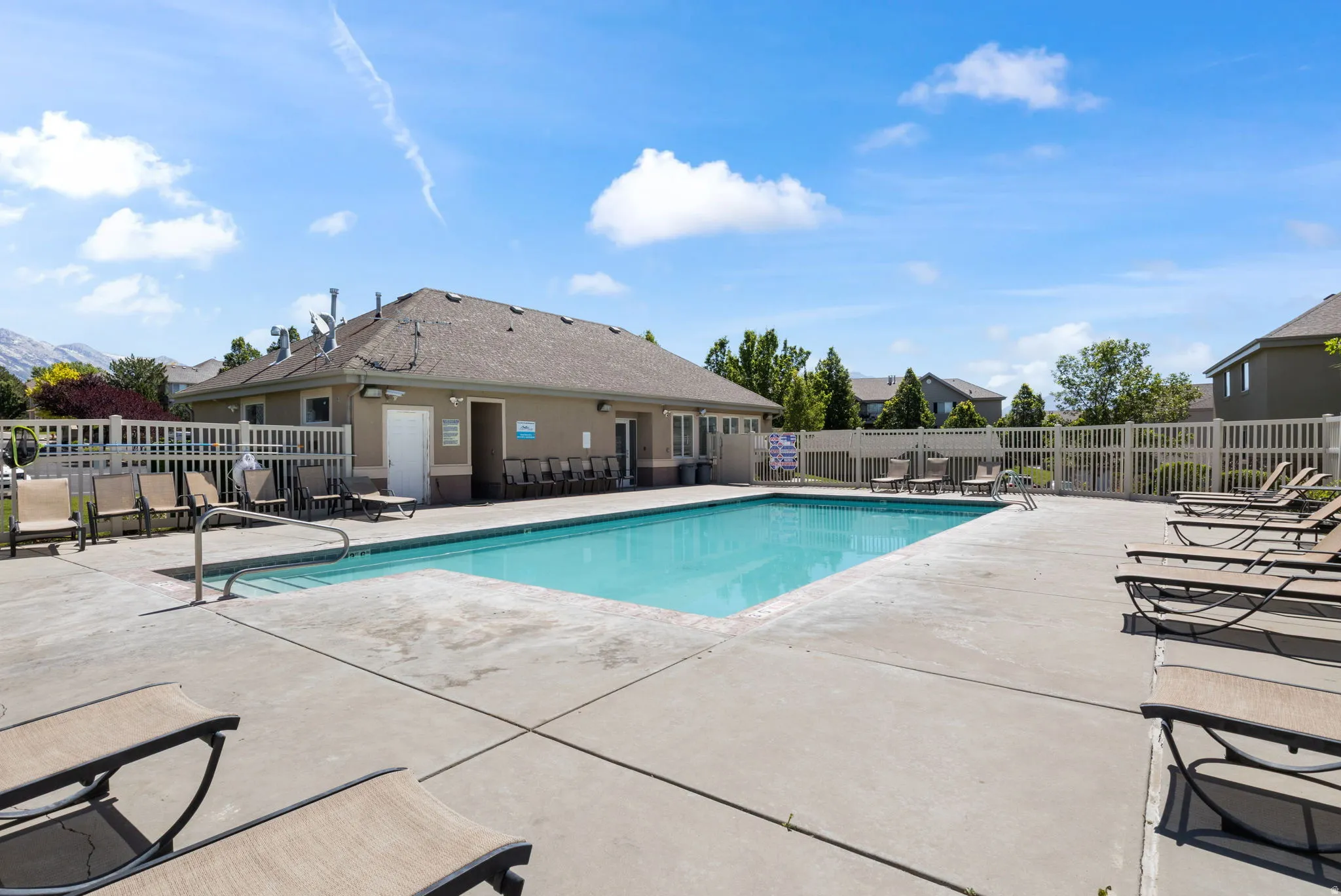 Rectangular swimming pool with a surrounding concrete deck