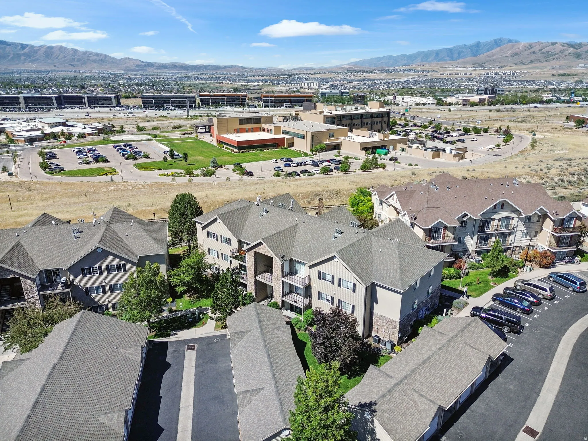 Multi-story residential buildings featuring gabled roofs and private balconies