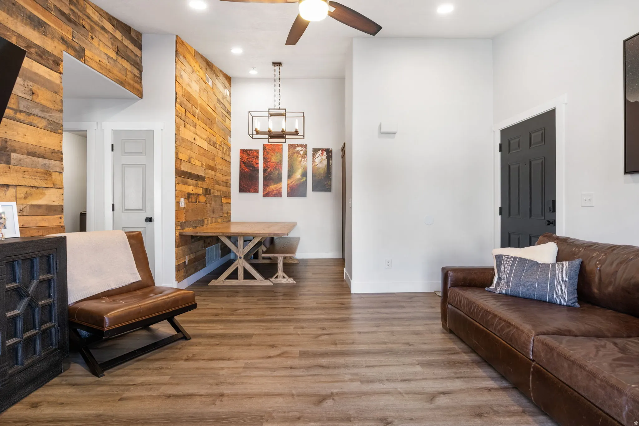 Open-concept living area featuring wood-finish flooring throughout