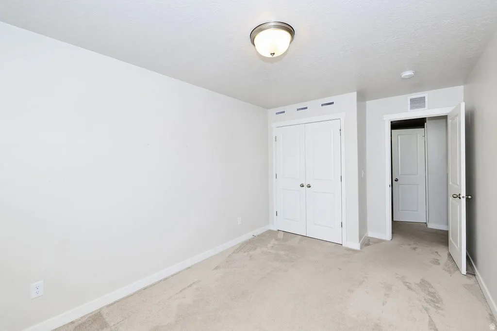 Neutral-toned carpeting throughout
