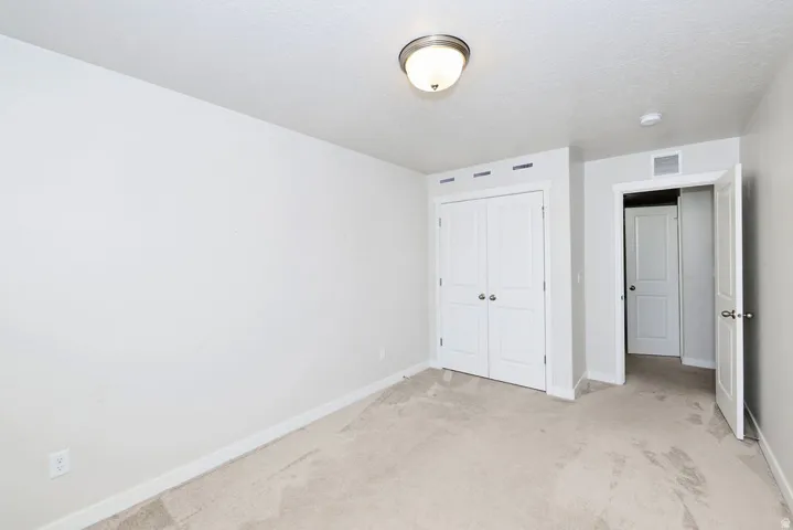Neutral-toned carpeting throughout