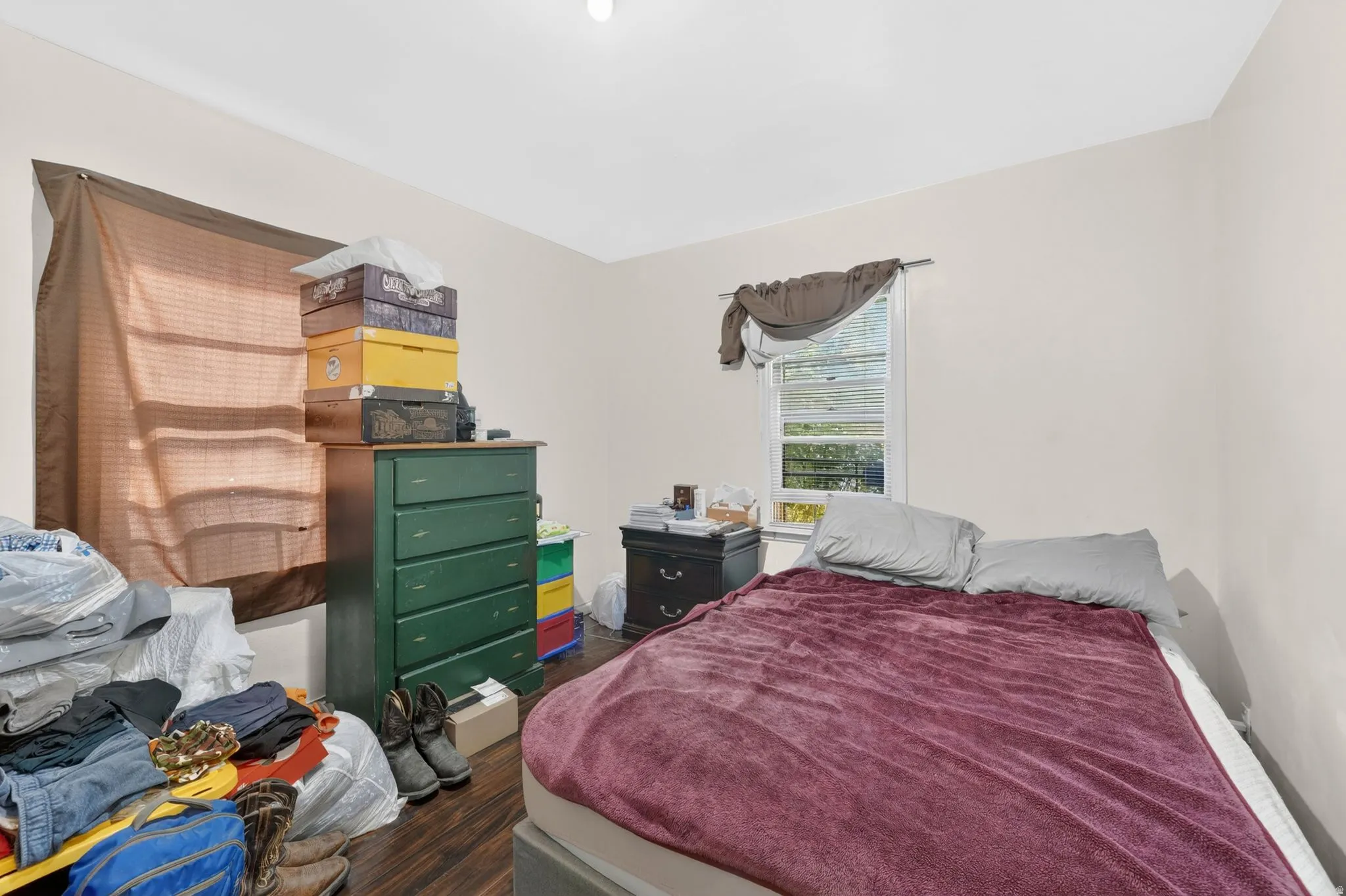 Room featuring neutral painted walls and wood-finish flooring