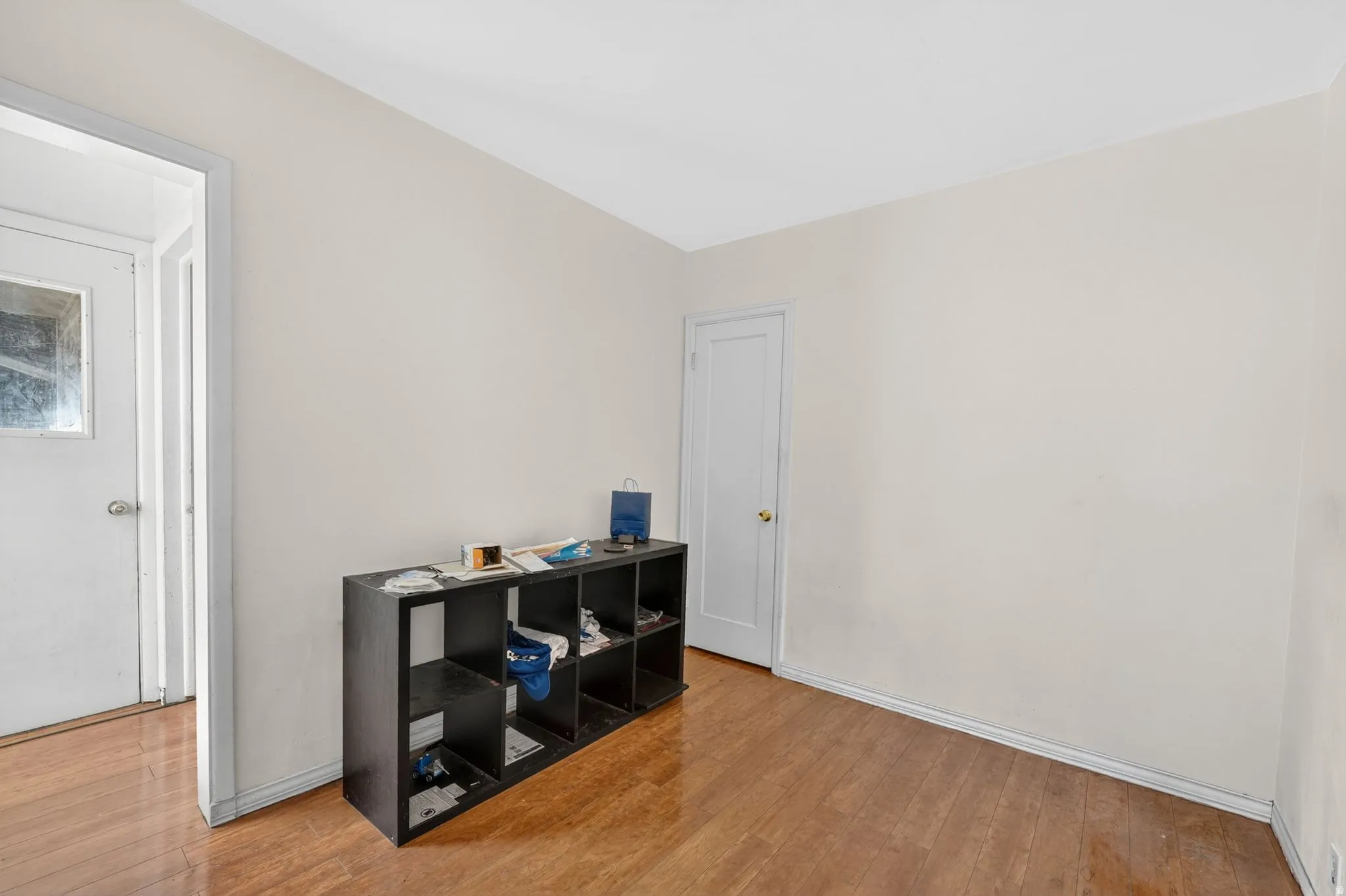 Neutral-toned walls complement wood-finish flooring