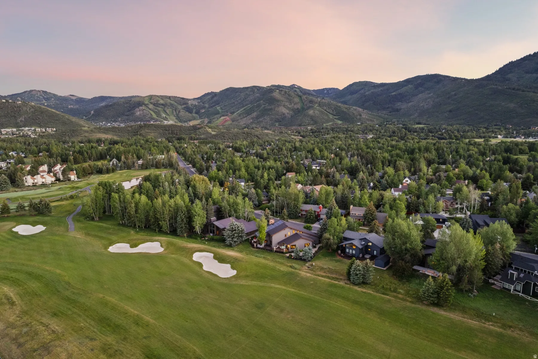 Expansive golf course frontage with sand traps and green fairways