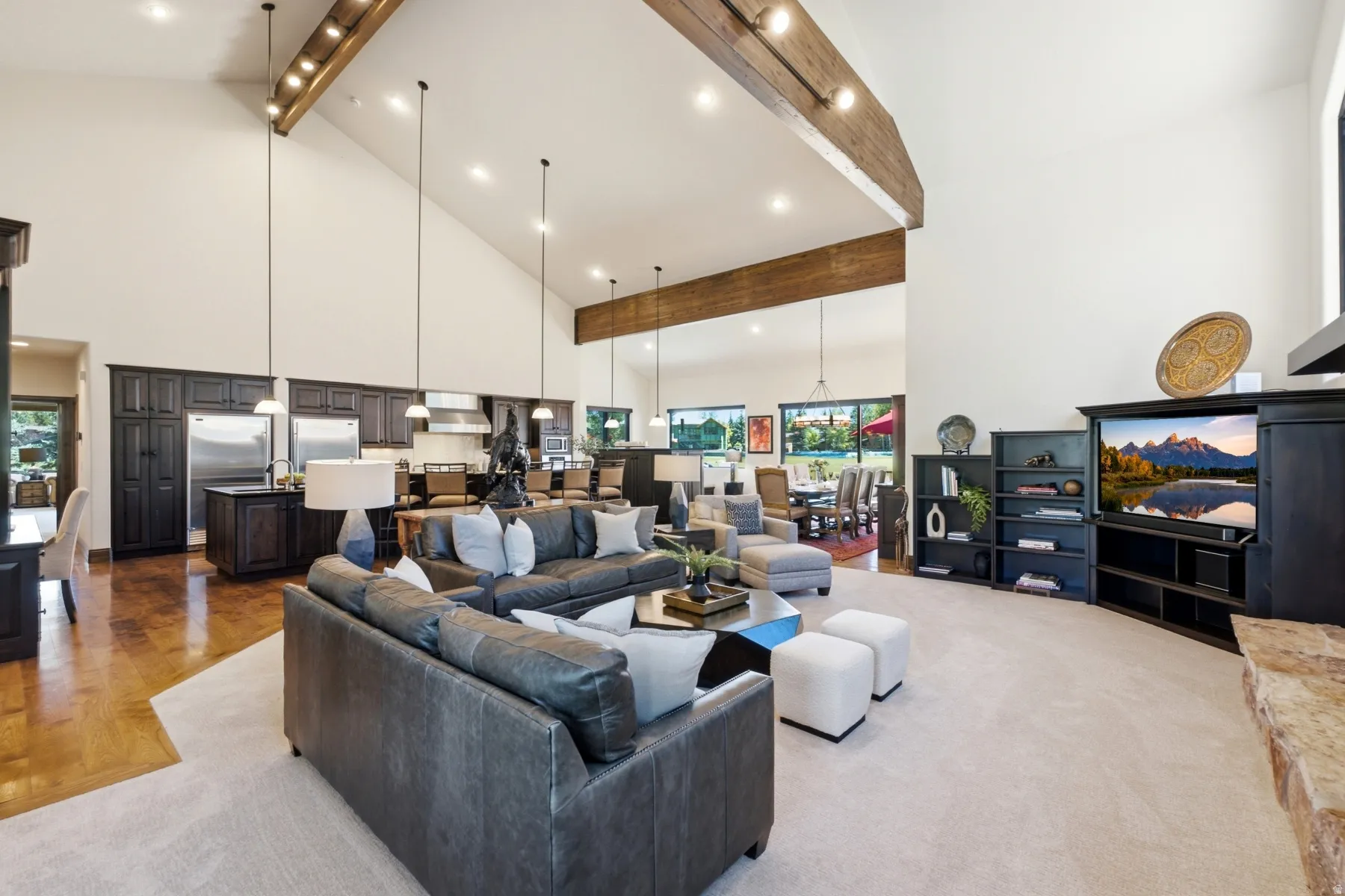 Great room featuring vaulted ceilings, exposed wood beams, and recessed lighting
