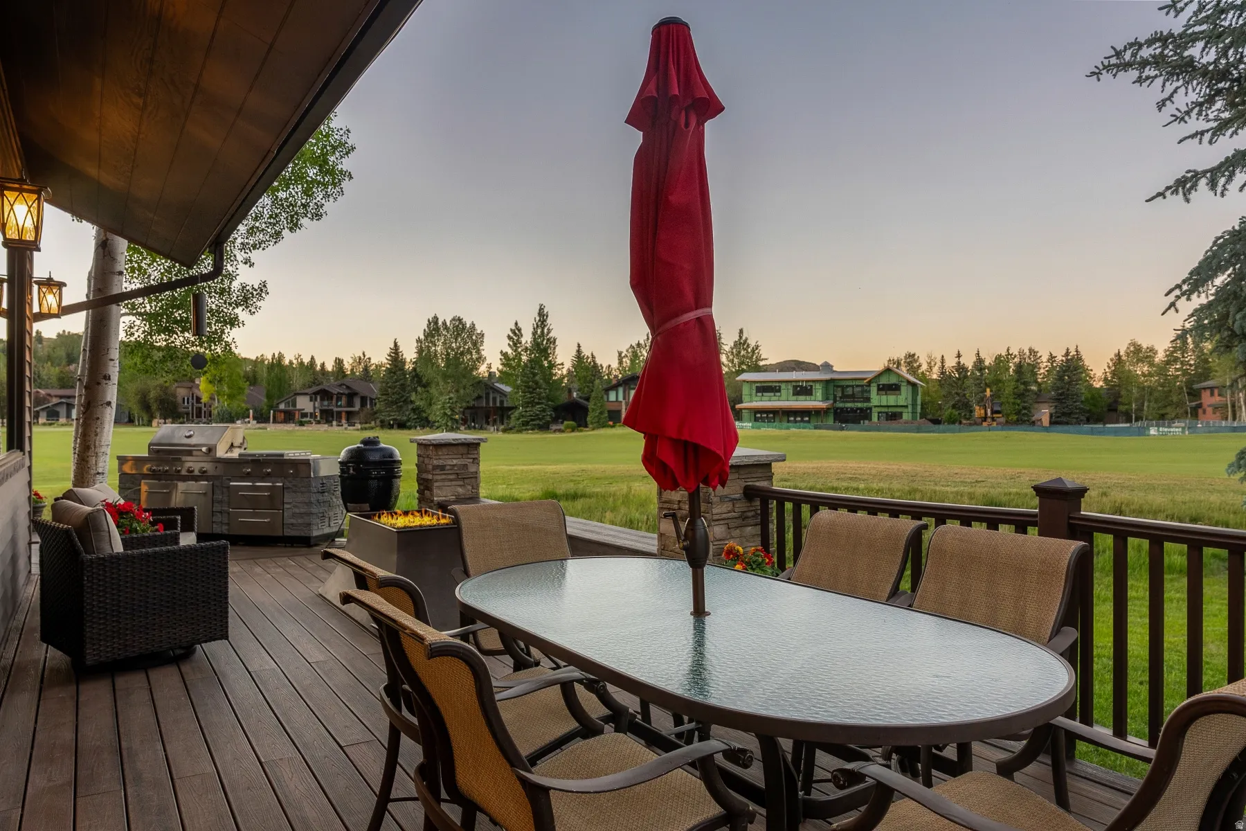 Expansive outdoor deck featuring wood-finish flooring