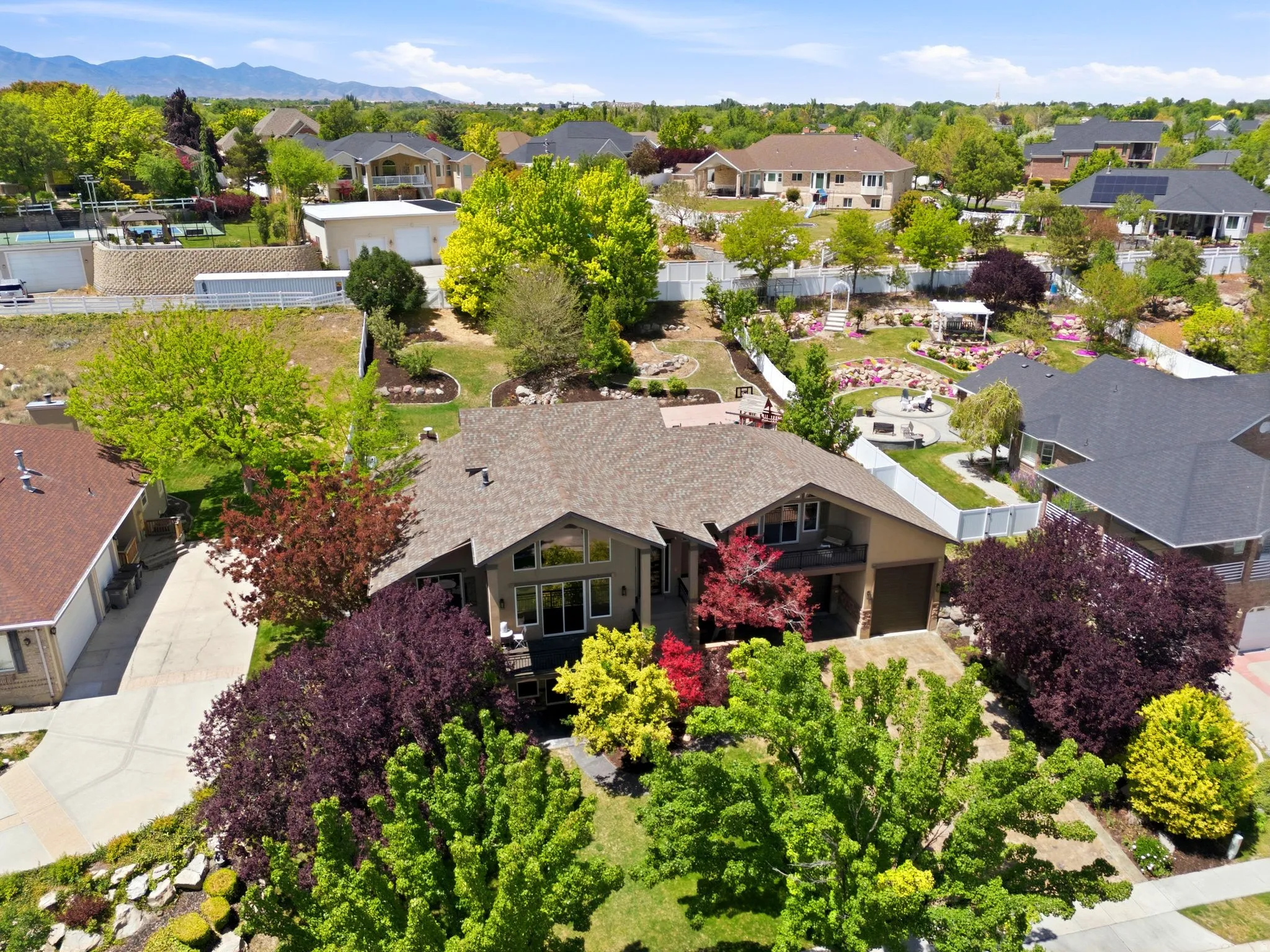 Custom residence featuring a multi-level design and a prominent gable roof