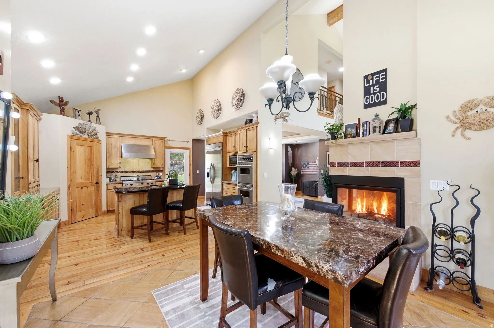 Open-concept living space with a vaulted ceiling and recessed lighting