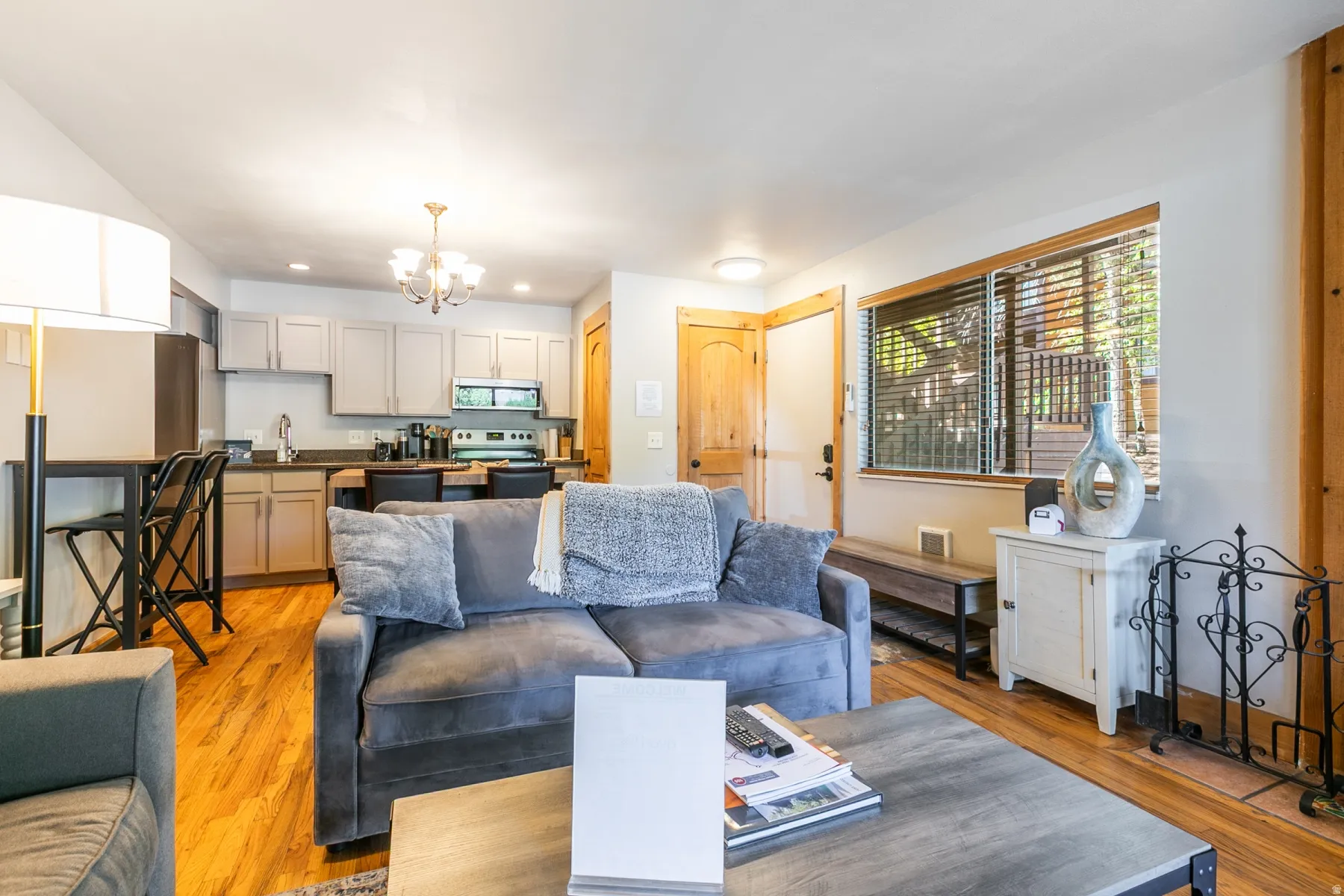 Open concept living area featuring wood-finish flooring