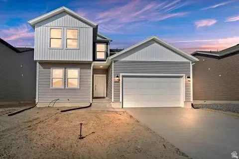 Contemporary two-story residence with light gray horizontal and vertical siding