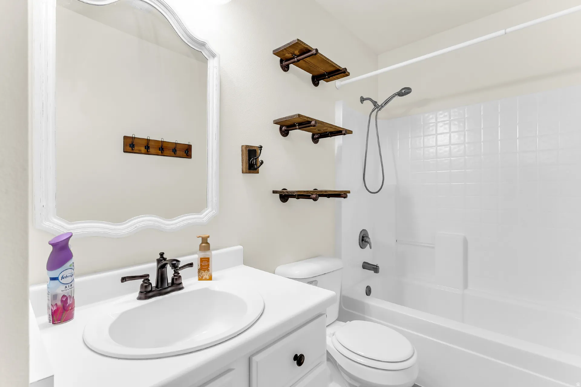 White vanity with an integrated sink and bronze-finish faucet