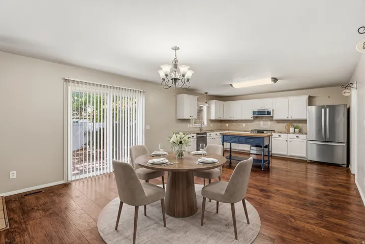 Wood-finish flooring throughout the dining area and kitchen