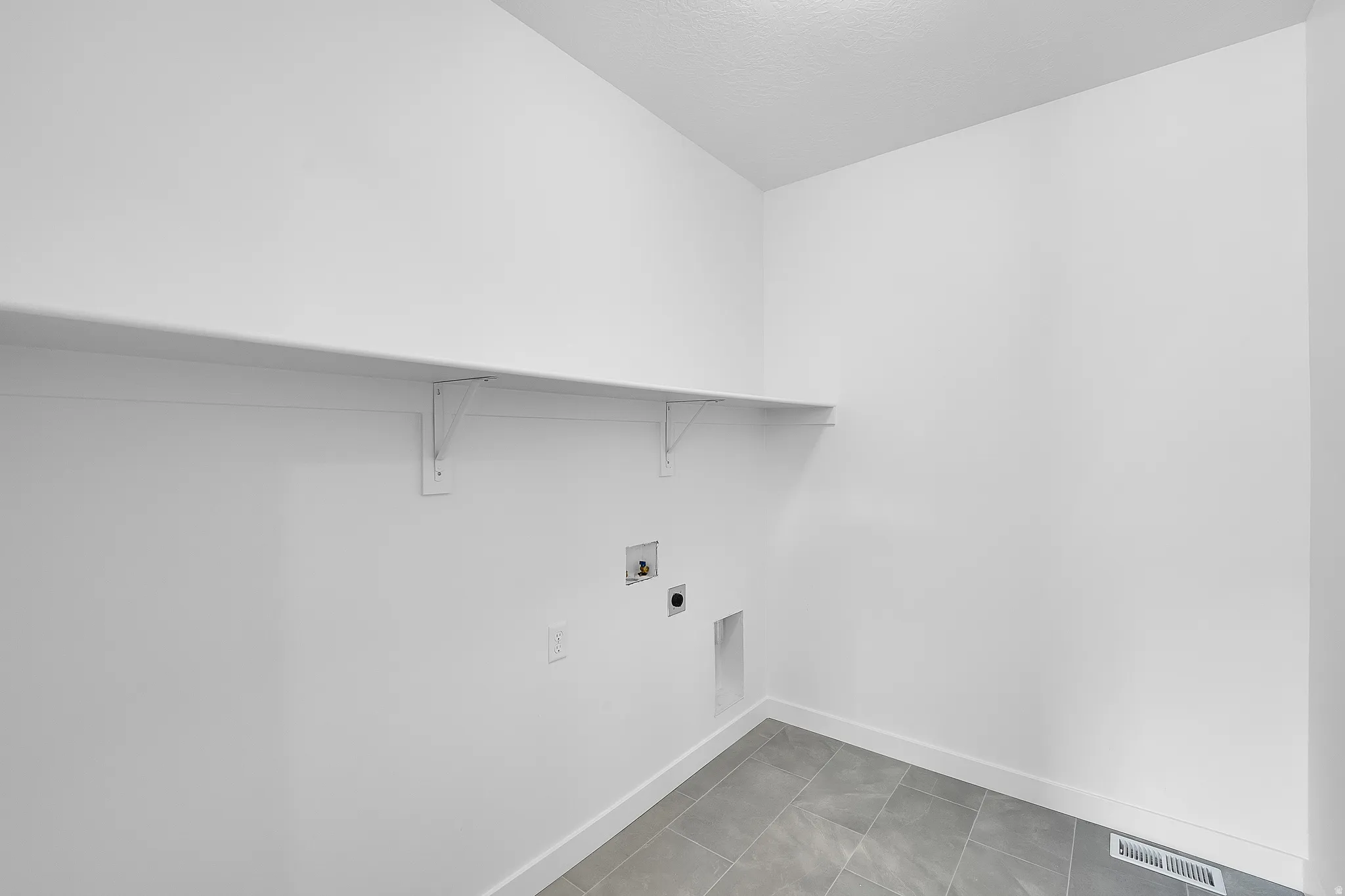 Dedicated utility space featuring a neutral color palette