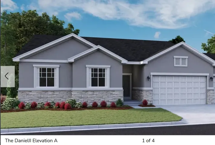 Contemporary exterior featuring a light gray stucco finish and a stone veneer wainscoting