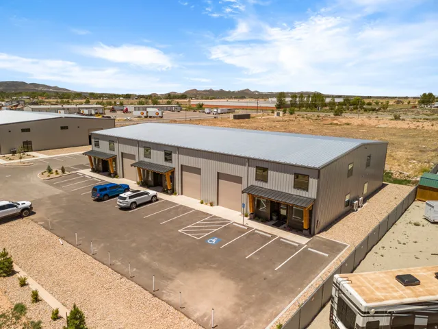 Modern industrial building featuring a metal roof and corrugated metal siding