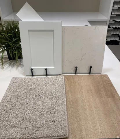 White shaker style cabinetry paired with a quartz-finish countertop