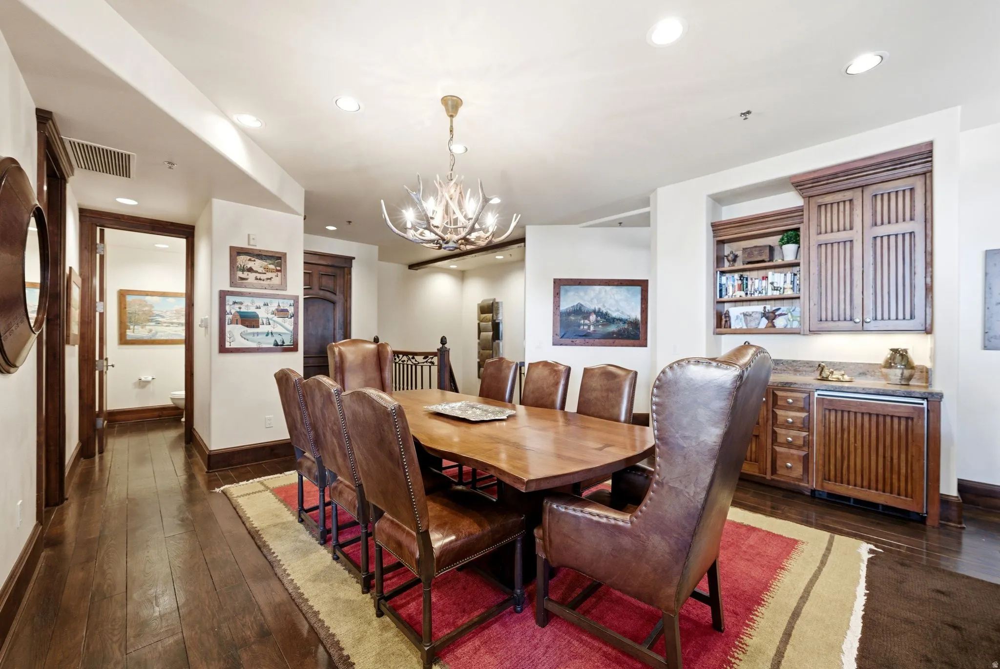 Dining area featuring wood-finish flooring and recessed lighting