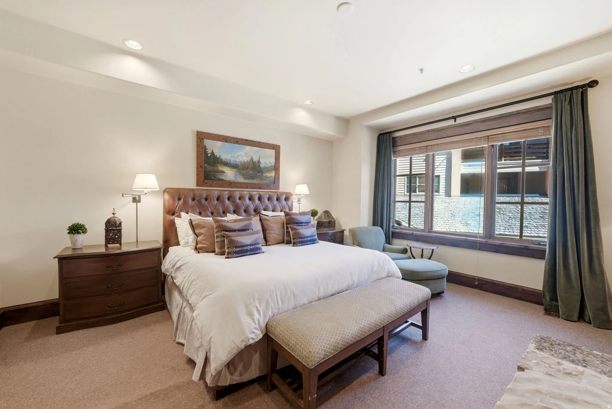 Carpeted bedroom featuring a large window with wooden blinds, recessed lighting, and crown molding