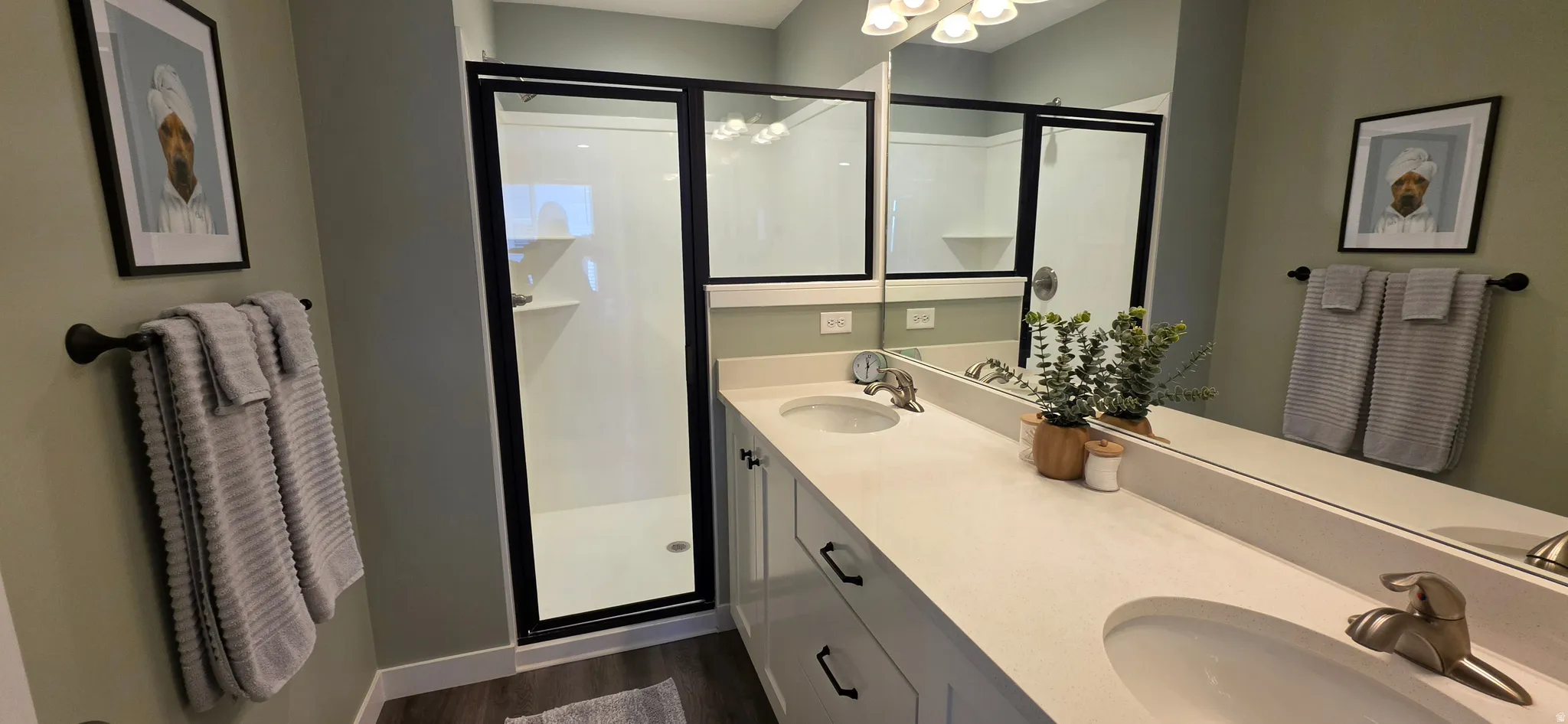 Dual vanity with white countertops and undermount sinks