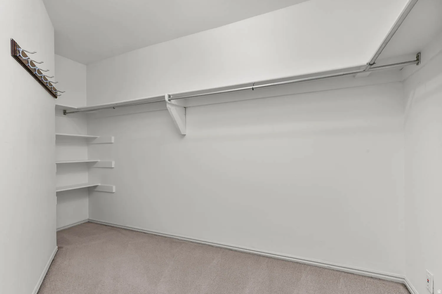 Primary bedroom walk-in closet