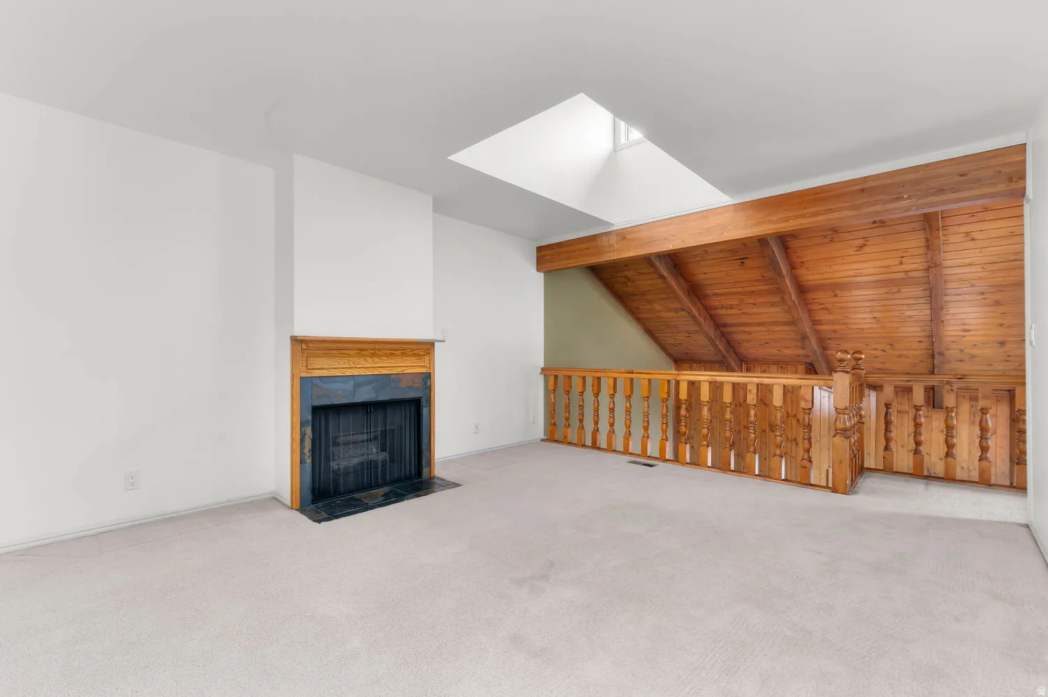 Upper level den with fireplace- unstaged