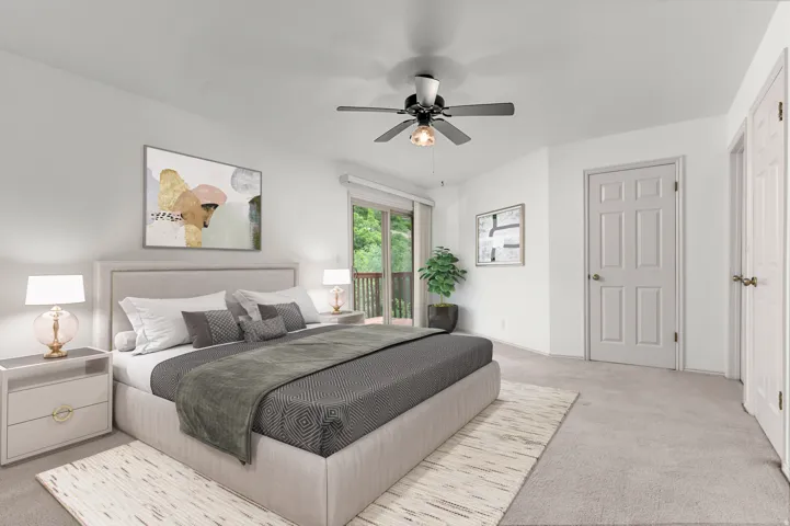 Primary bedroom with balcony- virtually staged