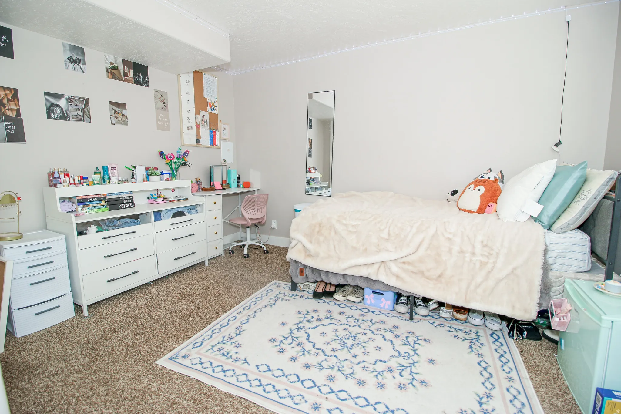 Light-colored walls complement the textured carpeting