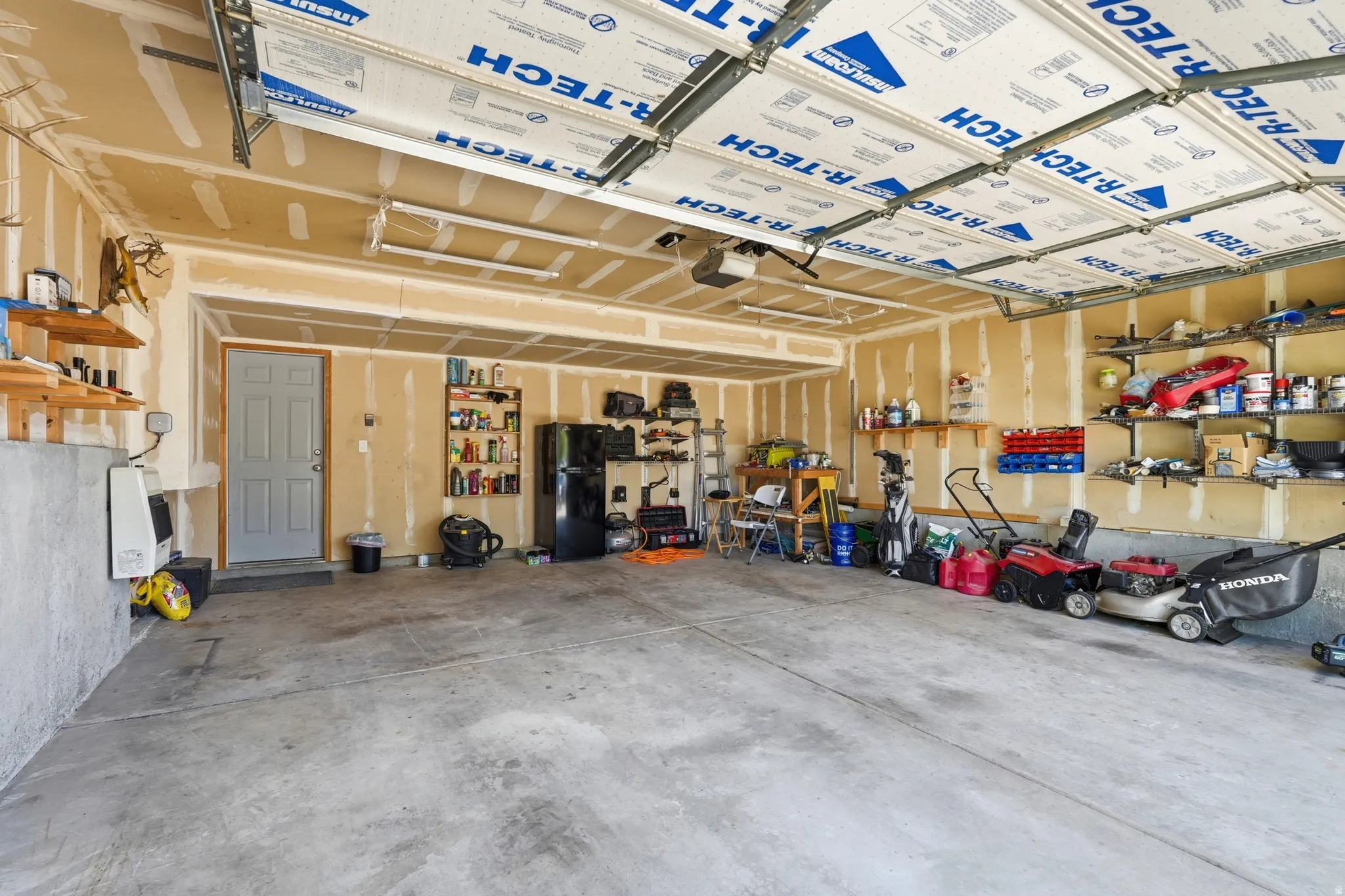 Spacious garage with concrete flooring