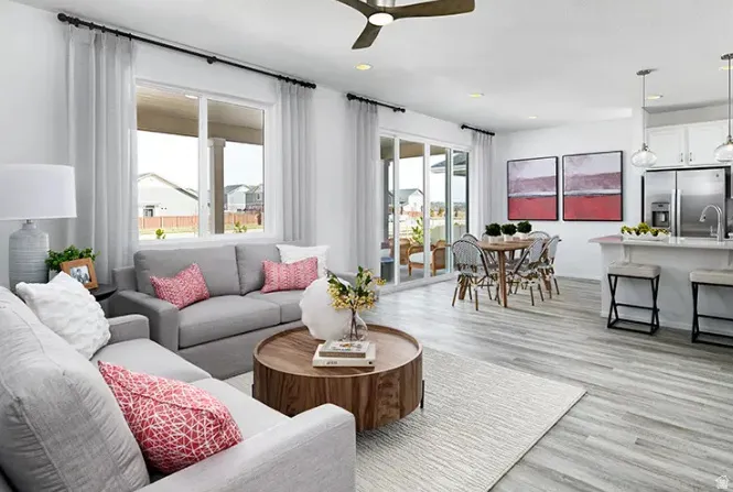 Open-concept living space featuring wood-finish flooring, recessed lighting, and a ceiling fan