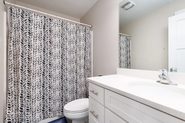 Bathroom vanity with a white countertop and integrated sink