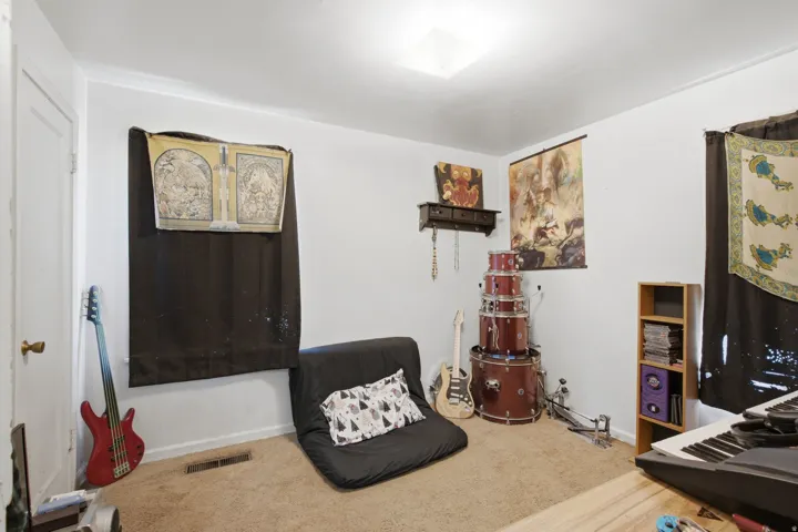 Room featuring light-colored walls and wall-to-wall carpeting