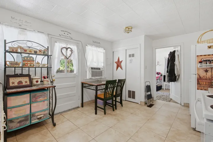 Neutral tile flooring extending throughout the space