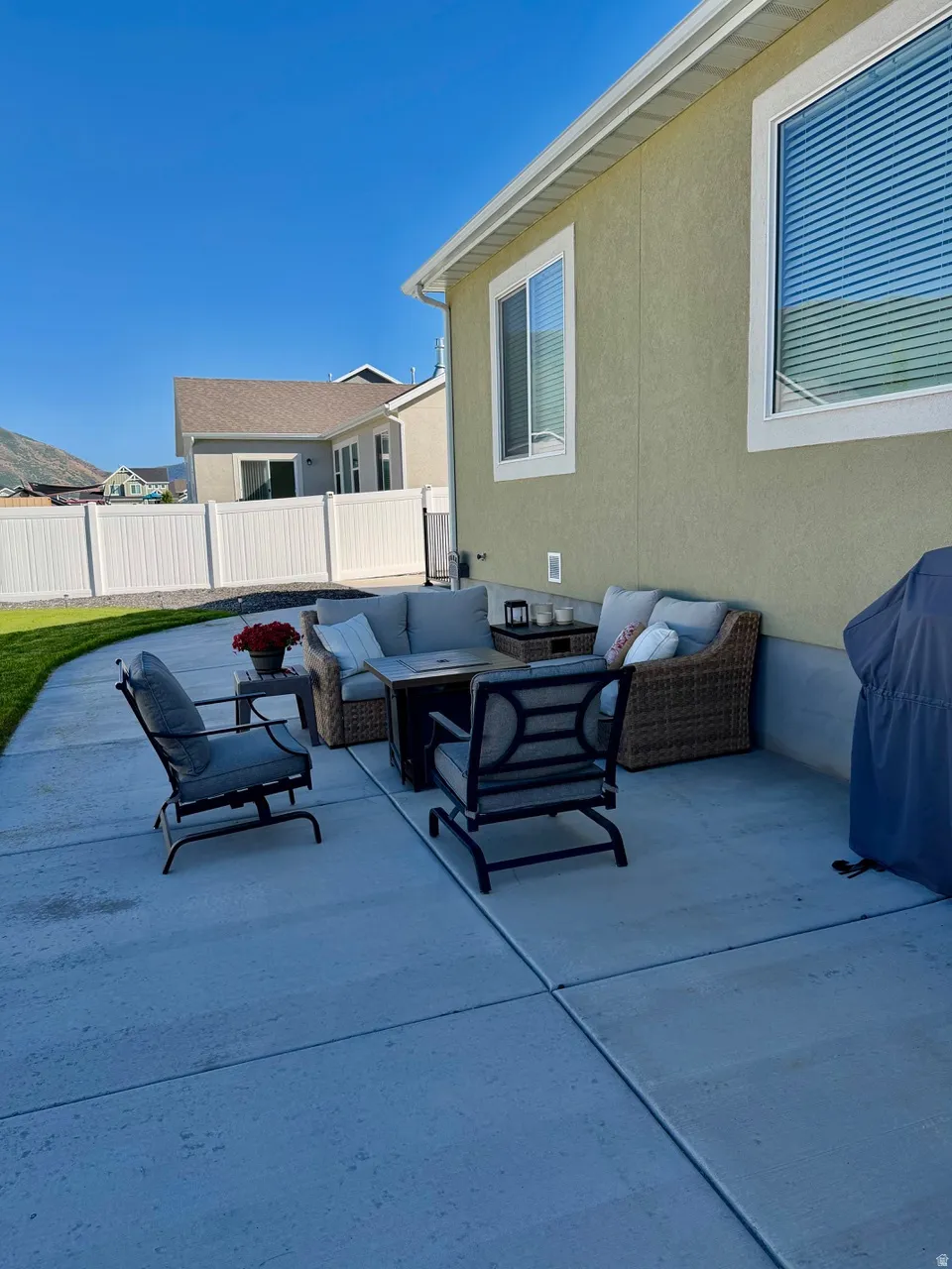 Expansive concrete patio with a stucco exterior