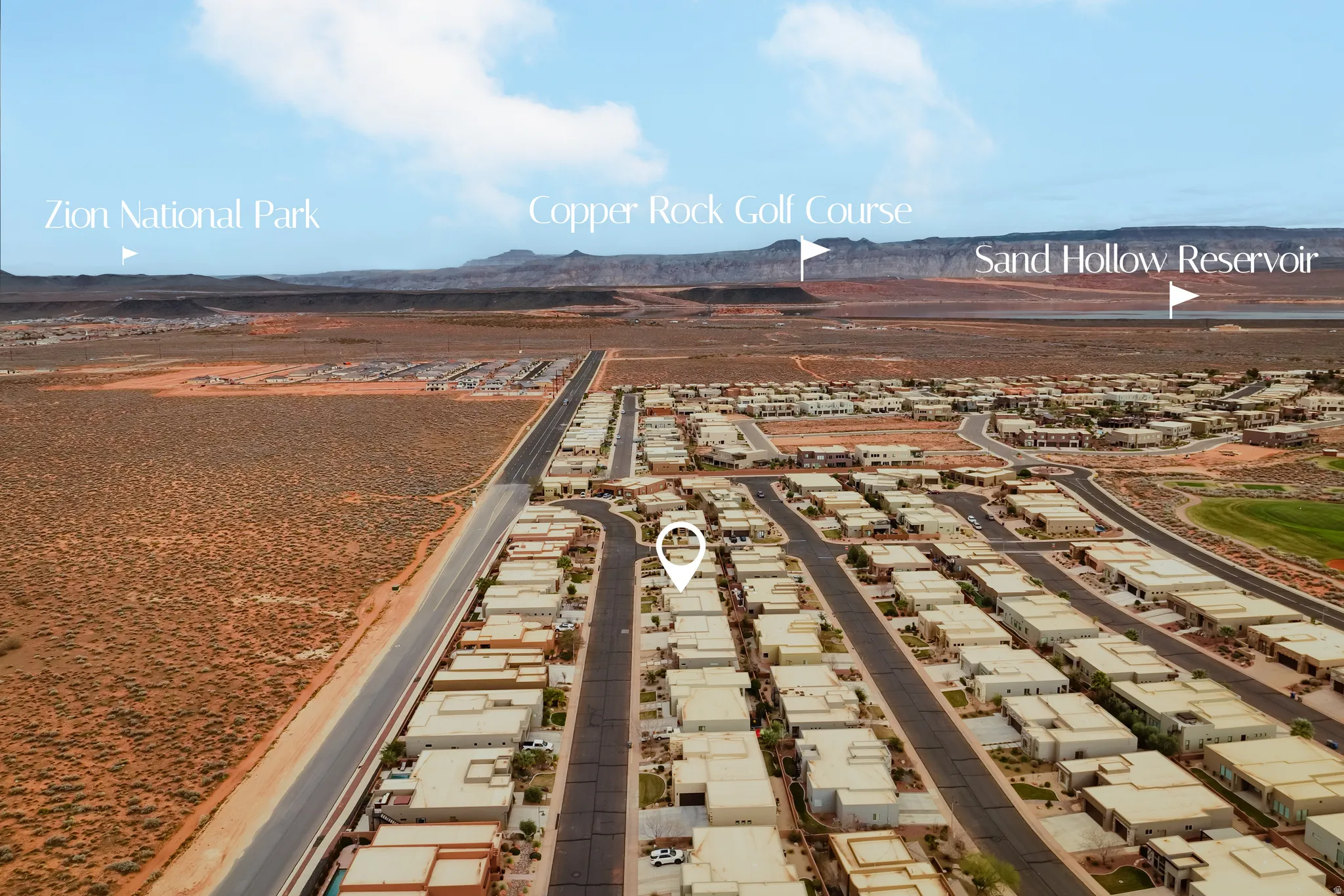 Aerial perspective showcasing a residential development with desert landscaping