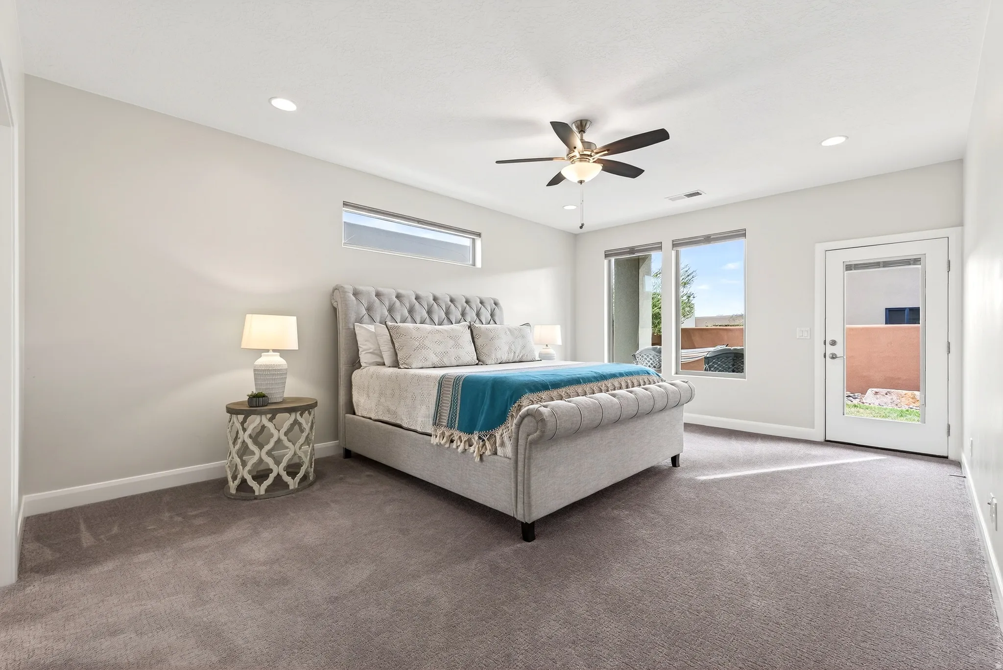 Recessed lighting, ceiling fan, and carpet flooring