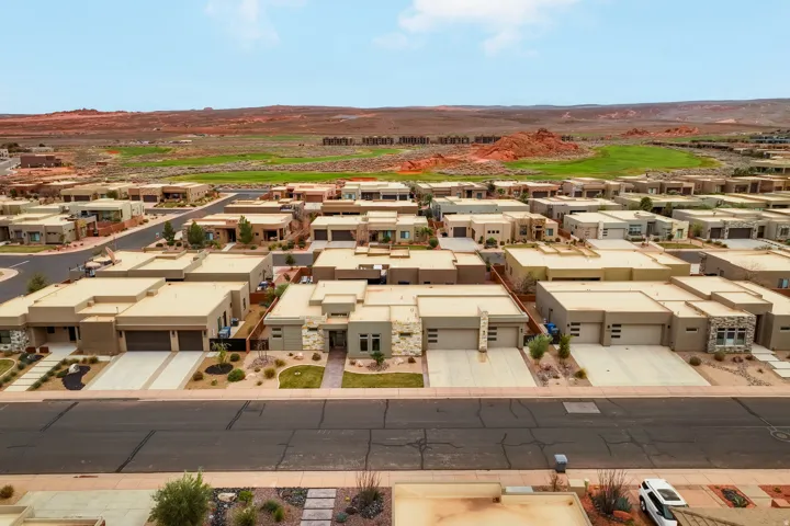 Contemporary residential properties featuring stucco exteriors and attached garages